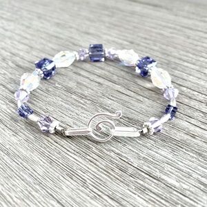 Beautiful clear and purple Swarovski crystal and sterling silver bracelet.